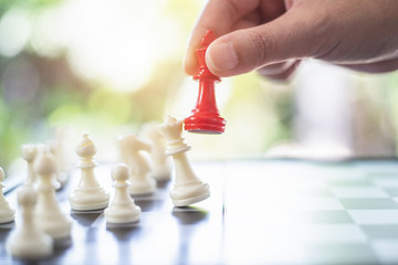 Business women play with chess game. concept of business strategy and tactic