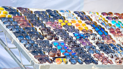 Obraz premium Sunglasses displayed on stall