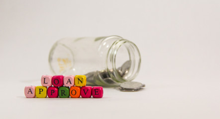 Loan Approve with colourful alphabet on white background.