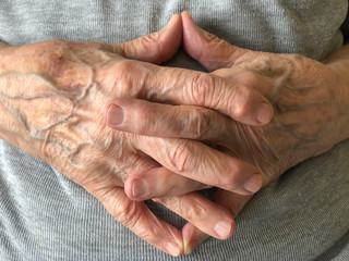 closeup wrinkled hands of a senior person