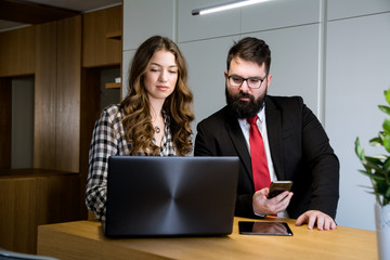 Business people working together on laptop