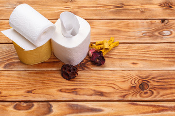 Toilet paper rolls on wooden background top view