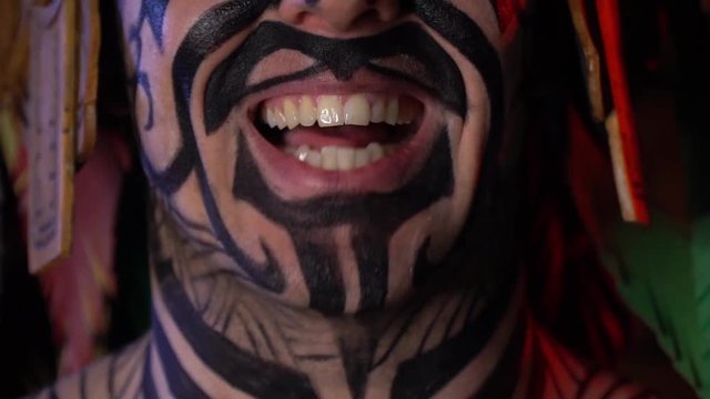 Close up of the mouth of an ancient tribal man talking and opening his mouth