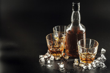 Glass of the whiskey and a square decanter