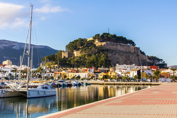 Panoramic view of Denia Port Marina promenade and Castle