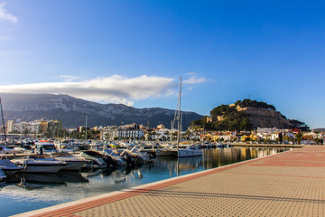 Fototapeta na wymiar Panoramic view of Denia Port Marina promenade and Castle