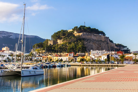Panoramic view of Denia Port Marina promenade and Castle