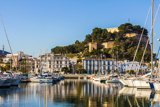 Panoramic view of Denia Port Marina promenade and Castle
