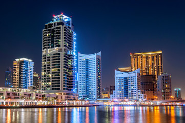 Night view on downtown of Dubai Marina with modern high skyscrapers. Dubai downtown, United Arab Emirates.