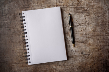 Plain empty notebook on a metal background, taken with copy space