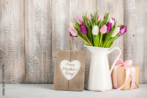 Mother's Day background  with fresh tulips and gift