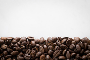 Coffee beans in arch on a white background text space