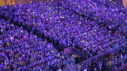 People in the stands during a concert / sporting event