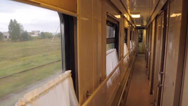 An aisle in a moving train