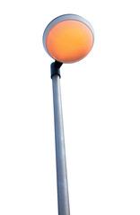 Street lamp glowing orange isolated