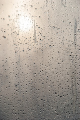 raindrops on glass in sunny weather