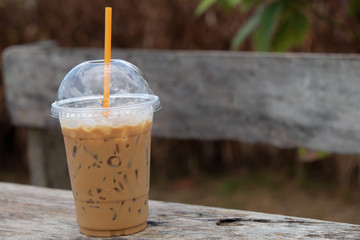 Ice coffee on wooden table