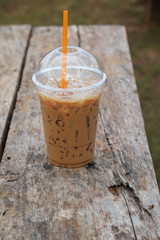 Ice coffee on wooden table