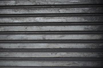 Fototapeta premium Shutter door surface stained by engine oil