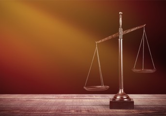 Law scales on table background. Symbol of justice