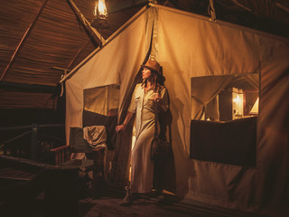Obraz na płótnie Canvas Beautiful woman in a tent at savanna, Kenya