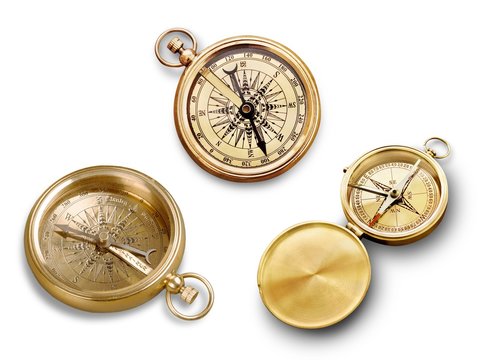 Brass antique compass  on background