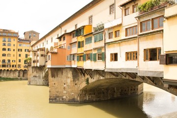 Fototapeta na wymiar Fragment of Ponte Vecchio bridge over Arno river in Florence. Close up photo. Architecture and landmarks of Florence, Italy.
