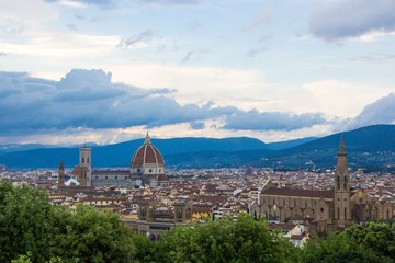 Fototapeta na wymiar View of the Cathedral of Santa Maria del Fiore and the Basilica of Santa Croce. Evening Florence, Italy.