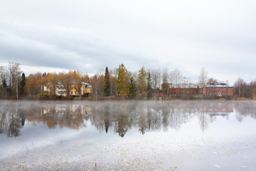KOUVOLA, FINLAND - OCTOBER 23, 2018: Beautiful wooden Rabbelugn Manor - Takamaan Kartano in fog autumn day. Wrede family house was built in 1820 on the river Kymijoki bank