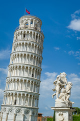 Vertical photo of famous Pisa Tower and Putti Fountain sculpture. Toscana travel attractions, Italy.