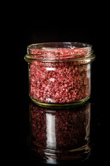 glass jar with big red organic sea salt