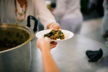 Free distribution of food to the poor in today's society