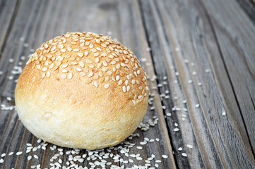  Sesame seed bun on wooden table