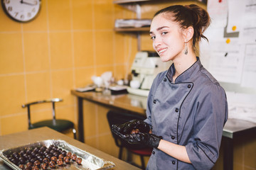 Subject profession and cooking pastry. young Caucasian woman with tattoo of pastry chef in kitchen...
