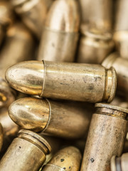 Top close-up macro view of large group of gun bullets