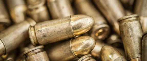 Top close-up macro view of large group of gun bullets