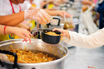 Providing food to the poor is helping people in a happy society.