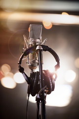 Headphones and Condenser Microphone in a Music Recording Studio