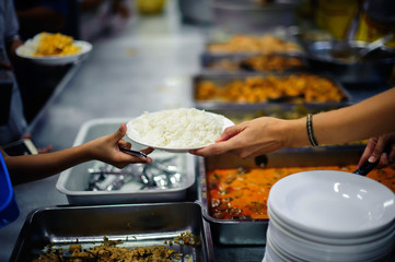 volunteers give food to local poor people, the villagers gladly accept the food as it may be the only food they get in a long while.