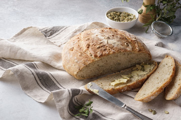 Whole grain bread and slice with butter and seeds for breakfast.