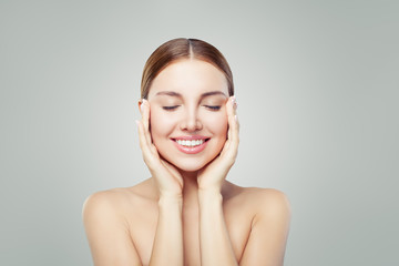 Woman relaxing. Eyes closed. Young perfect female face. Spa treatment, skincare and cosmetology...
