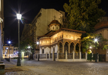 Bucharest old city centre panorama view. Stavropoleos Church by night. Old town tourist attraction in Romania