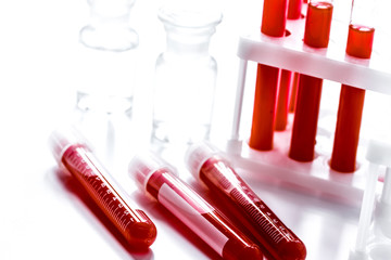 glass tubes with blood sample in stand no one