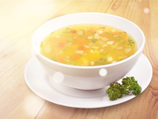 Bowl of delicious vegetables soup on  table
