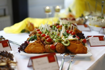 Close up of decorated breaded schnitzel at a wedding buffet table