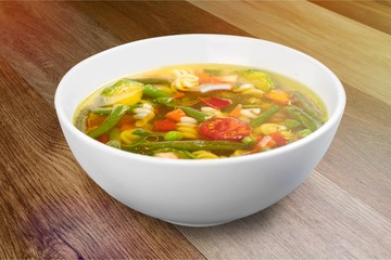 Bowl of delicious vegetables soup on  table