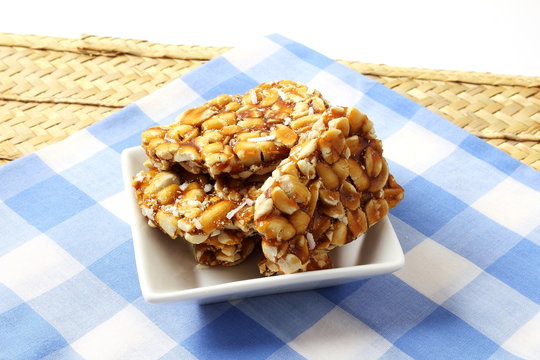 homemade traditional indian sweet chikki  or peanut candy bar made with rosated peanut and jaggery