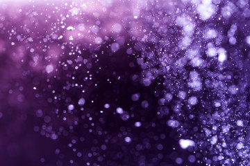 Abstract purple bokeh defocus glitter background.