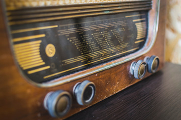 Close up on old vintage radio on hardwood