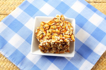 homemade traditional indian sweet chikki  or peanut candy bar made with rosated peanut and jaggery